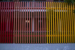 Metal fence pattern texture painted with multicolored paint in the Park photo