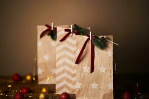 Christmas gift bags with decor and Christmas ornament. photo