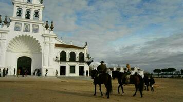 Riders on church of Rocio Virgin in Huelva a spring afternoon video
