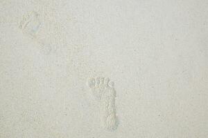 Footprints on the beach photo