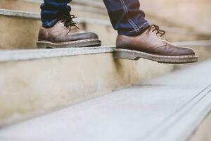 A man walking down the stairs at the office photo