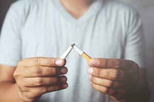 Man refusing cigarettes concept for quitting smoking and healthy lifestyle.or No smoking campaign Concept. photo