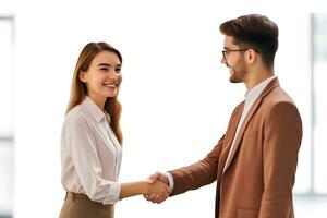 Caucasian young woman shaking hands with businessman photo