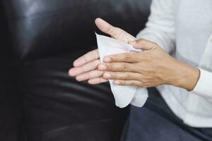 woman using tissue paper Clean your hands to remove germs. photo