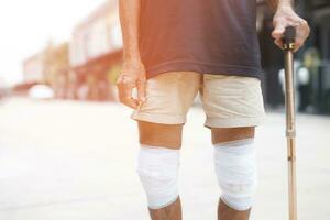 Asian senior Elderly man have knee pain and bone problems. photo