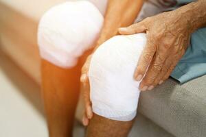 Asian senior Elderly man have knee pain and bone problems. photo