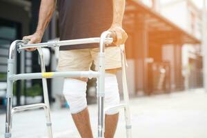 Asian senior Elderly man have knee pain and bone problems. photo