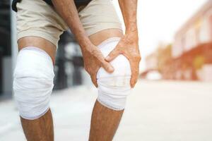 Asian senior Elderly man have knee pain and bone problems. photo