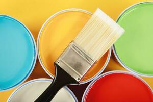 Texture paint cans and paint brushes and how to choose the perfect interior paint color and good for health photo