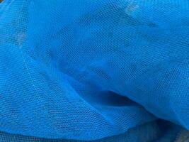 plastic net on a blue background. photo