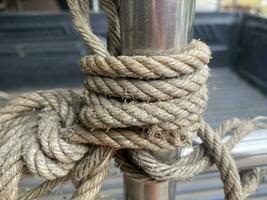 rope with a boat in the port photo