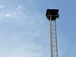 close up speaker tower on blue sky photo