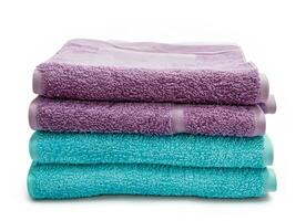 stack of colorful towels isolated on white background photo