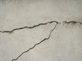 close up cracked concrete wall background photo