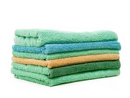stack of colorful towels isolated on white background photo