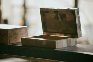 two wooden boxes sitting on a table photo
