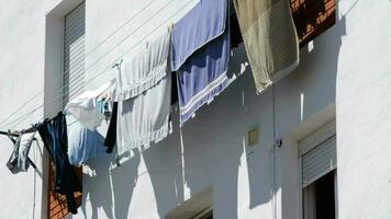 Clothes hanged to dry outside a block of flats or houses video