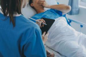 Injured patient showing doctor broken wrist and arm with bandage in hospital office or emergency room. Sprain, stress fracture or repetitive strain injury in hand. Nurse helping customer. First aid. photo