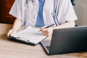 Medical technology concept. Doctor working with mobile phone and stethoscope in modern office photo