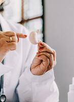 Female doctor holding virtual Lungs in hand. Handrawn human organ, copy space on right side, raw photo colors. Healthcare hospital service concept stock photo