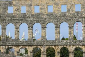 View inside the Roman amphitheater in the Croatian city of Pula without people photo