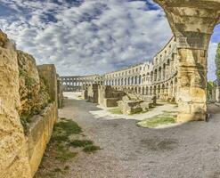 View inside the Roman amphitheater in the Croatian city of Pula without people photo