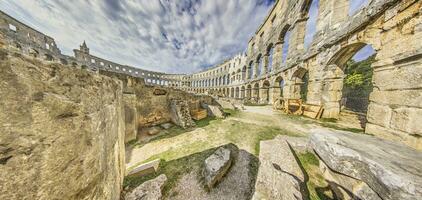 View inside the Roman amphitheater in the Croatian city of Pula without people photo