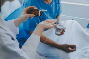 Injured patient showing doctor broken wrist and arm with bandage in hospital office or emergency room. Sprain, stress fracture or repetitive strain injury in hand. Nurse helping customer. First aid. photo