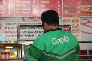 Magelang,Indonesia.11-09-2023.Olive Chicken one of the fast food restaurants in Indonesia and can be ordered via grab app grab food photo