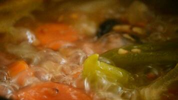 Soup of lentils boiling in a pot video