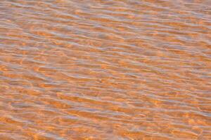 Orange water with waves photo