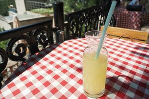 glass of orange juice outdoor photo