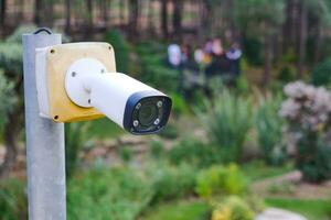 CCTV security camera operating outdoor photo