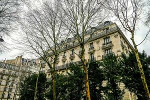 a building with trees in front of it photo