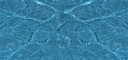 Defocus blurred transparent blue colored clear calm water surface texture with splashes reflection. Trendy abstract nature background. Water waves in sunlight with copy space. Blue watercolor shine. photo