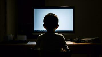 A young boy sitting in front of a computer screen represents the need to monitor and manage our technology use for a healthy lifestyle. AI Generated photo