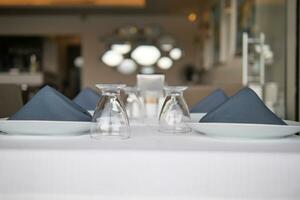 served and decorated round festive table in a restaurant photo