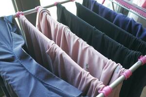 child clothes line filled with hanging trousers photo