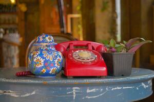 red color Retro telephone on table. photo