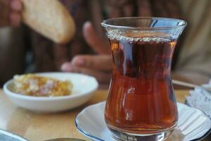 Traditional turkish tea on white table . photo