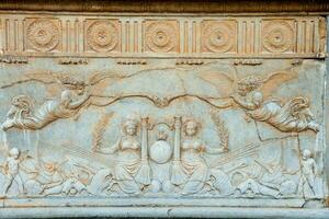 Cathedral wall relief in Italy photo