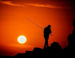 Fishing at sunset photo