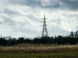 High voltage towers on skies background. Transmission line tower. photo