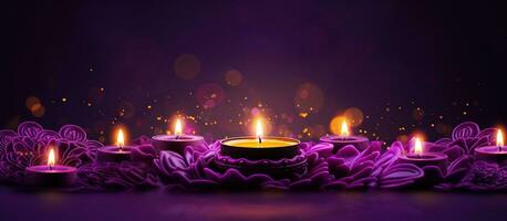 Glowing candles for Indian holiday Diwali Festival of light on purple background photo