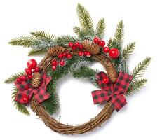Christmas wreath made of spruce branches, ribbon and red berries photo