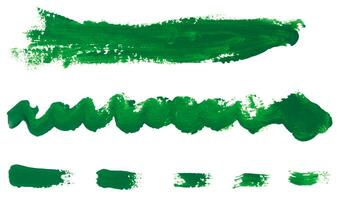 Watercolor brush stroke of green paint, on a white isolated background photo