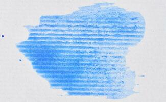 Blue blot on a white sheet of paper photo