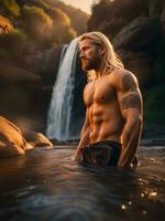 a vertical shot of a handsome male model with long blond hair posing on the rocks in the middle of the river photo