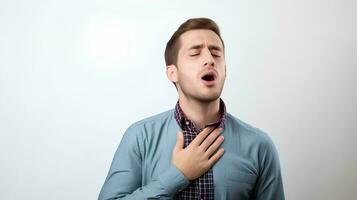 A young man suffering from an asthma attack, He holds his chest, on an isolated white background, AI Generative photo