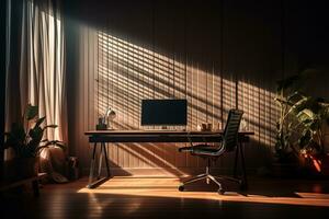 Desk with computer and chair in a room with potted plants. Beautiful shadow on the wooden wall. Remote work concept. photo